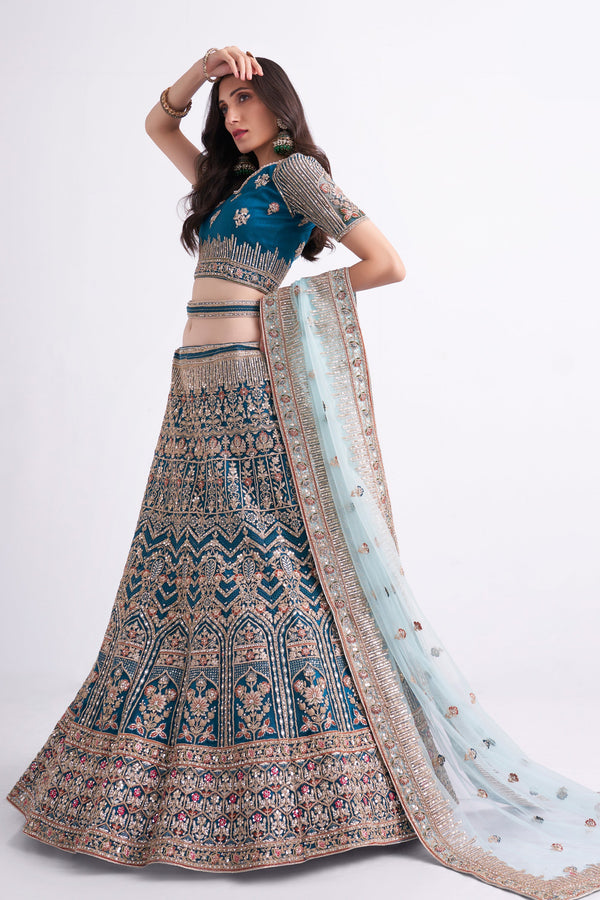 Women's Bridal Heritage Teal Blue Heavy Embroidered Net Designer Lehenga - CHITRAS