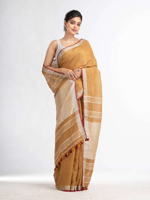 Women's saffron with silver zari pallu in silver zari border handwoven linen saree - Angoshobha