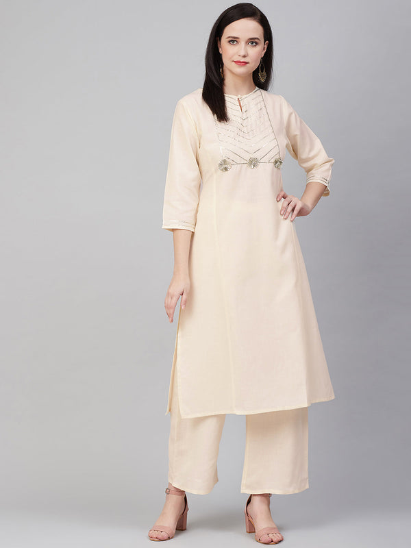 Cream-coloured yoke design kurta with palazzos