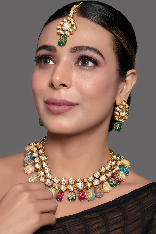 Women's Gold toned multicolored beaded kundan necklace teamed with matching earrings & mang tika - Femizen