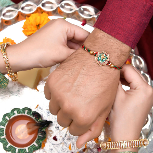 Traditional Om And Lord Ganesha Motif Thread Rakhi - Voylla