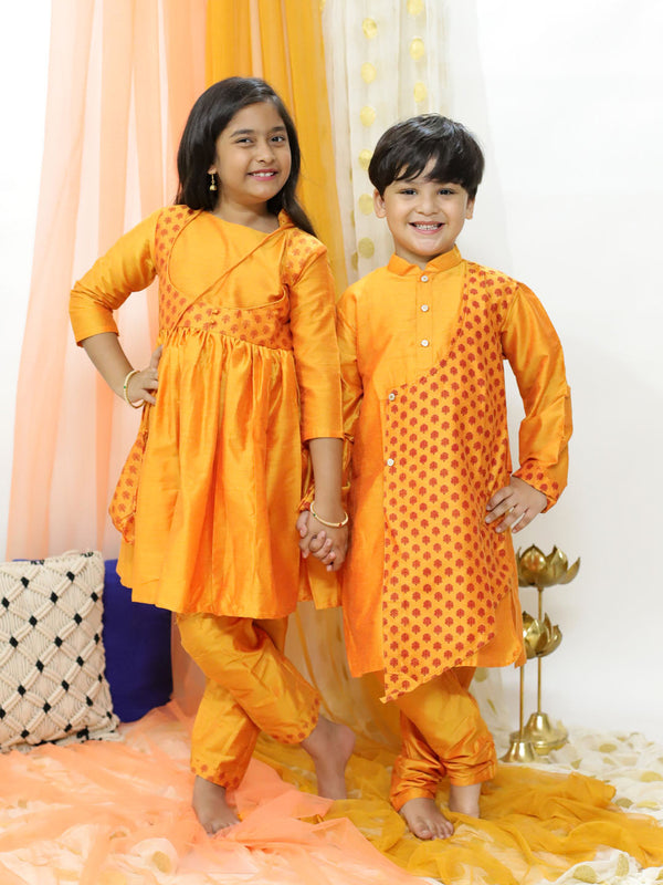 Jashvi Orange Silk Blend Ethnic Print Kurta Pyjama Sibling Set