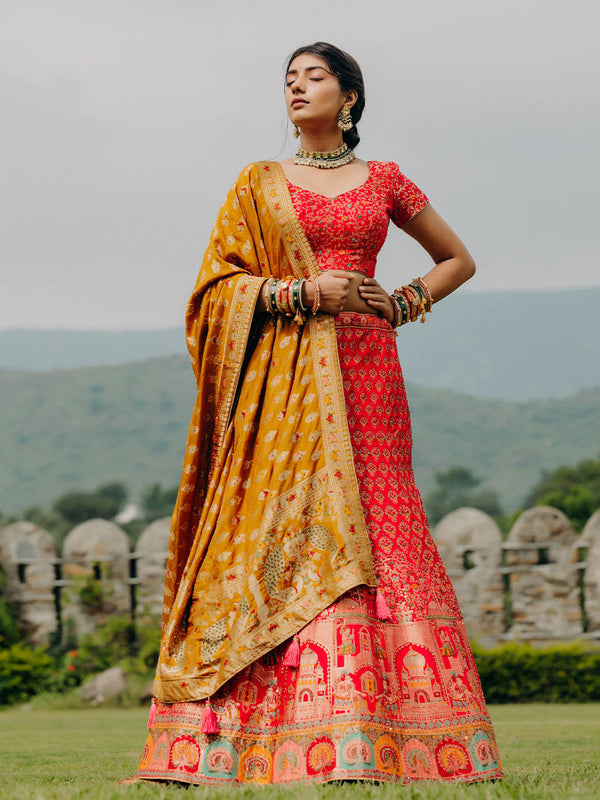 Graceful Orange Designer Unstitched Lehenga Paired With Authentic Yellow Dupatta