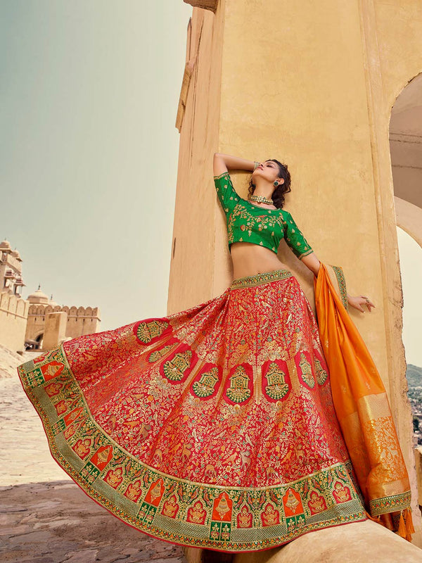 Alluring Indian Designer Red Lehenga Paired With Green Blouse & Orange Dupatta