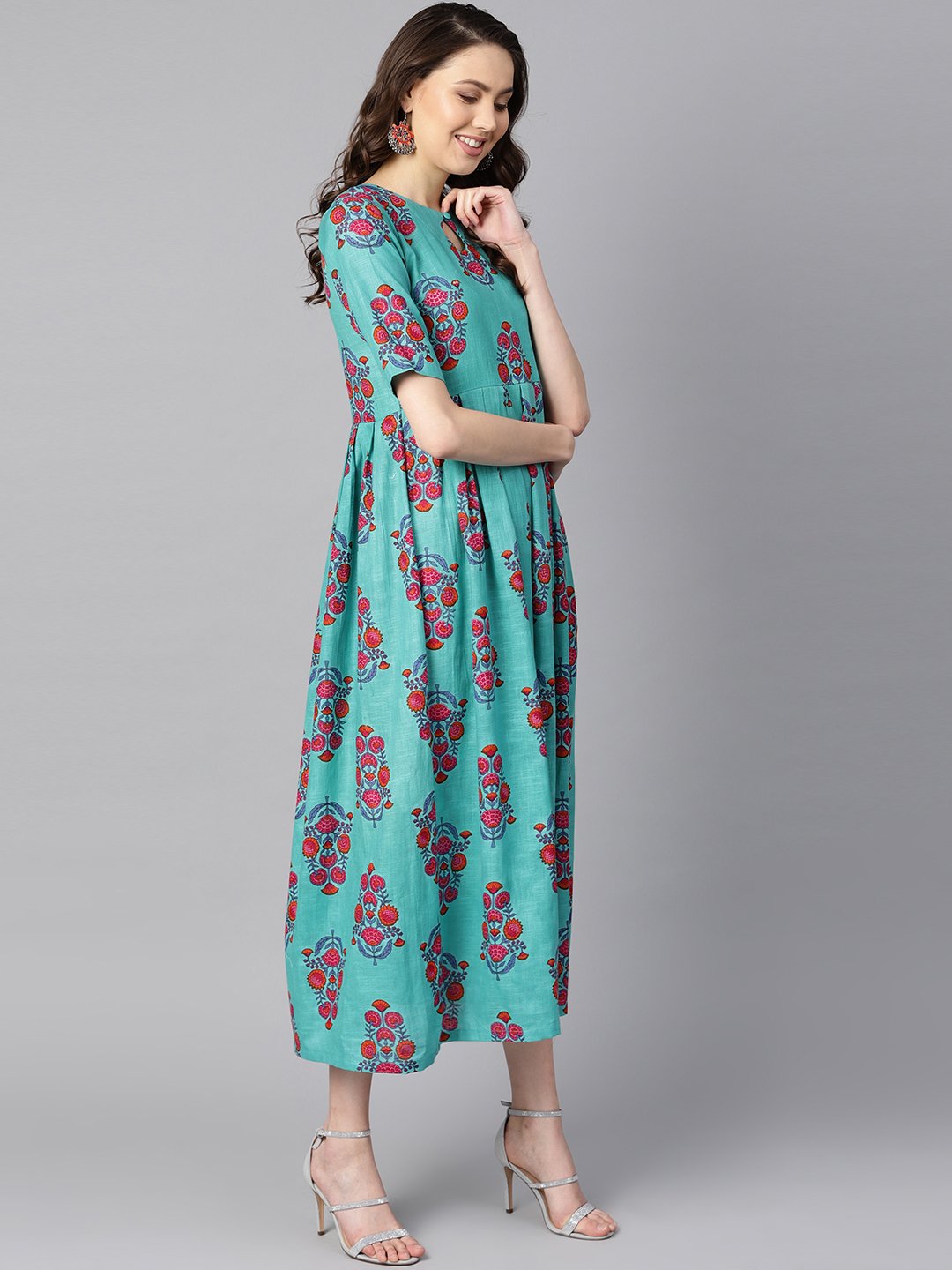 Turqish blue color printed half sleeve pleated maxi dress with deep back and tassel detailing. | NOZ2TOZ - Made In INDIA.