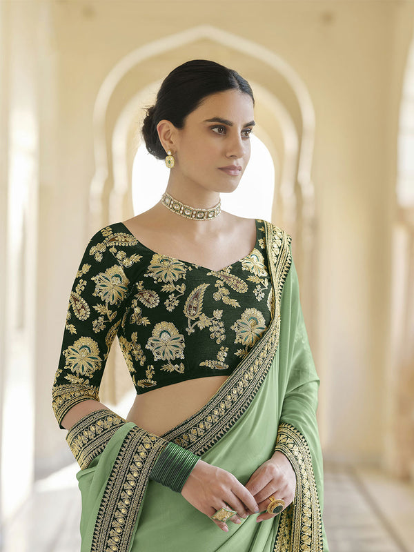 Alluring Pista Green Organza Saree Paired With Bottle Green Art Silk Blouse