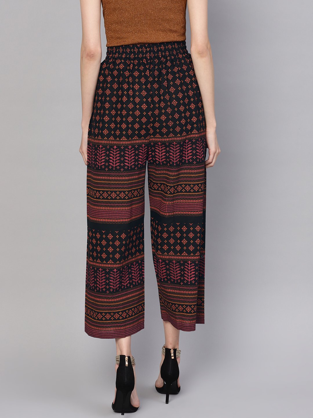 Women Black & Orange Printed Cropped Straight Palazzos | NOZ2TOZ - Made In INDIA.