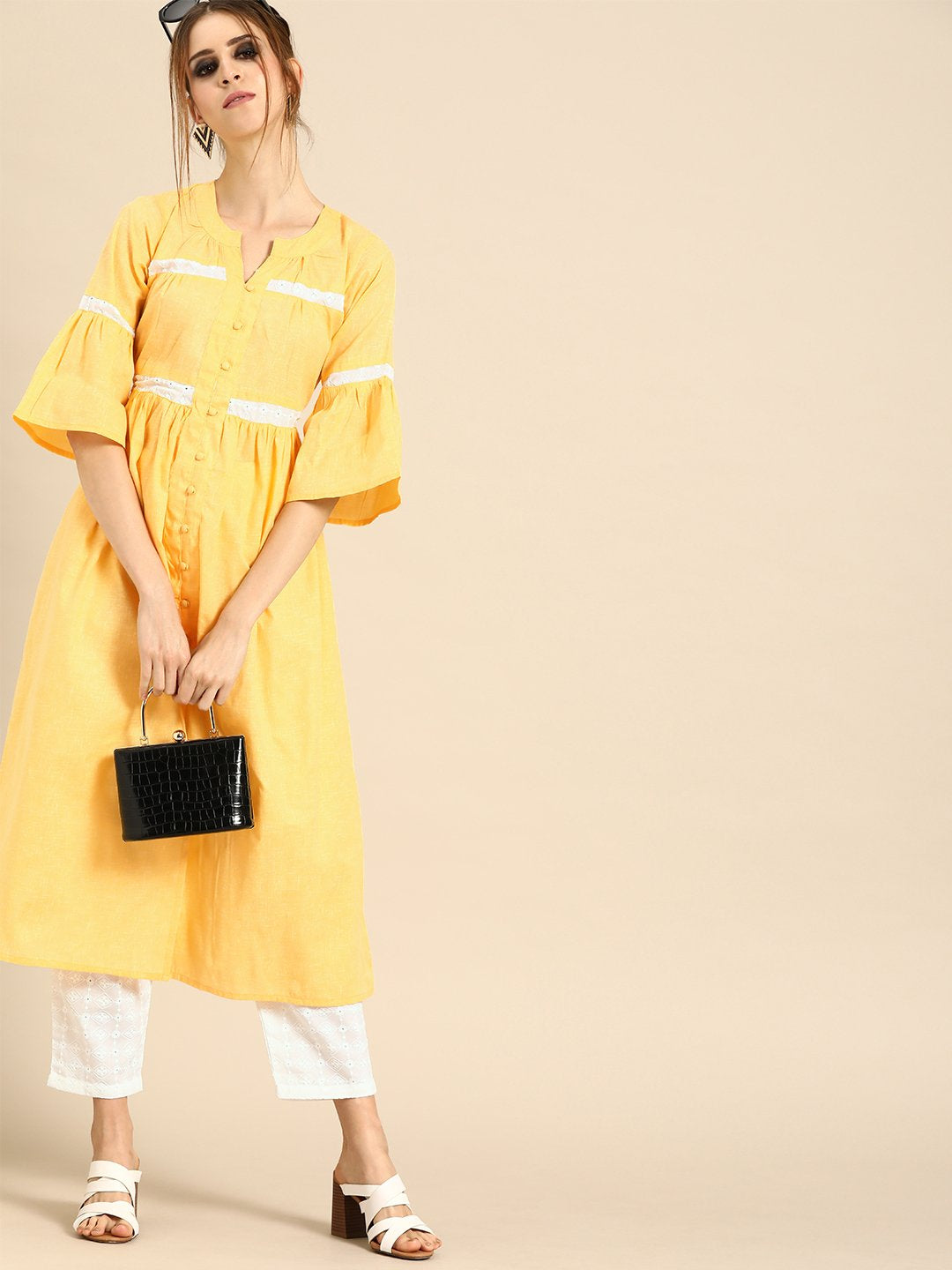 Women Pastel Yellow Three-Quarter Sleeves Solid Flared Pure Cotton Kurta with Schiffli Trouser | NOZ2TOZ - Made In INDIA.