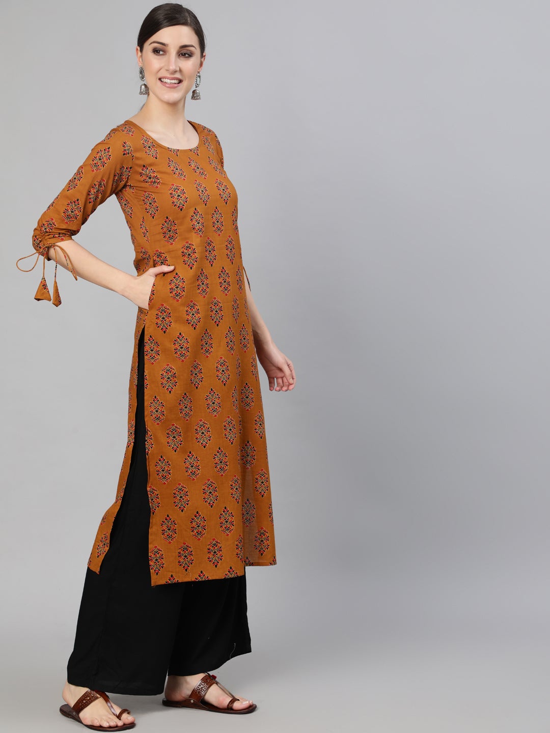 Women Mustard Ethnic Motifs Printed Straight Kurta With Tassel Detail | NOZ2TOZ - Made In INDIA.